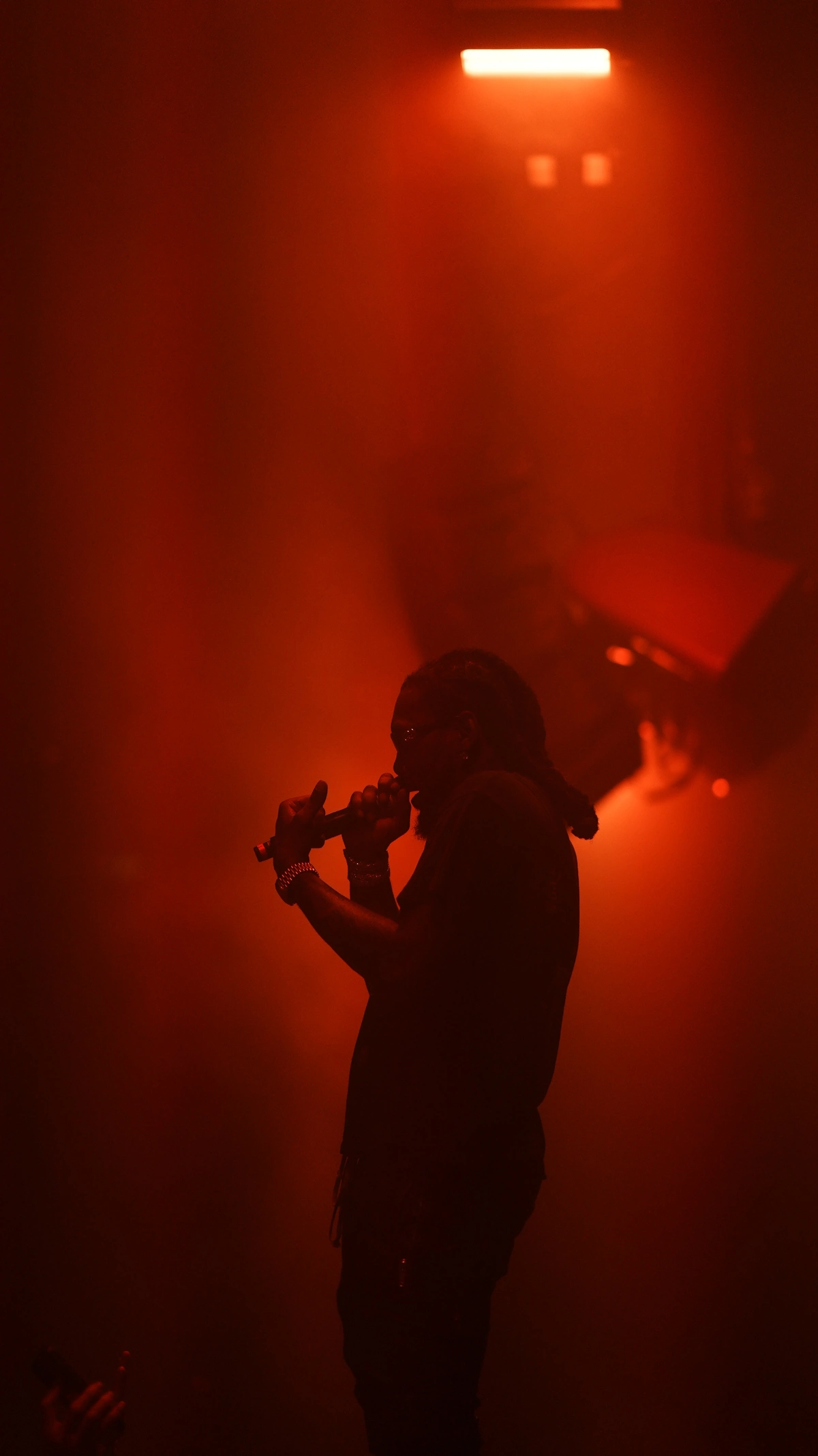 Offset silhouetted in red stage light at Klein Phönix